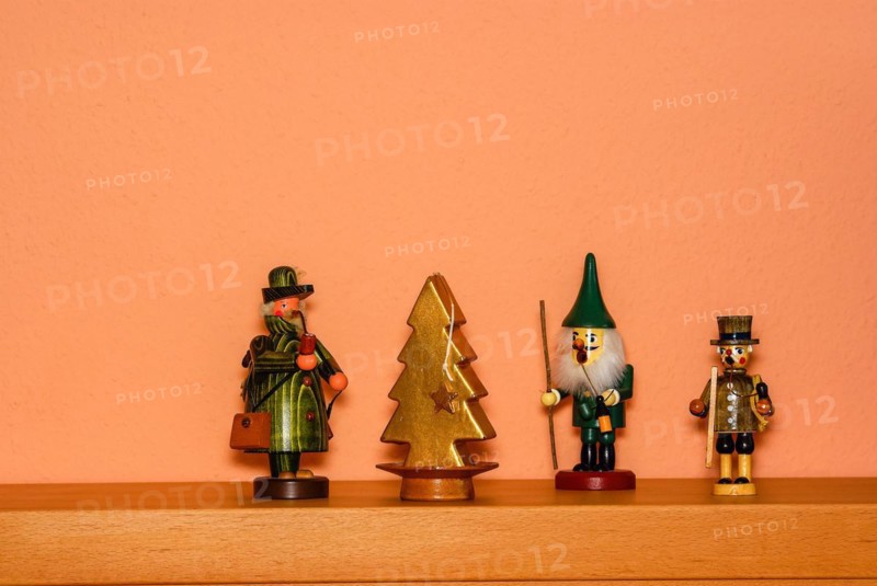 Christmas decoration consisting of three incense smokers and a candle in the shape of a fir tree