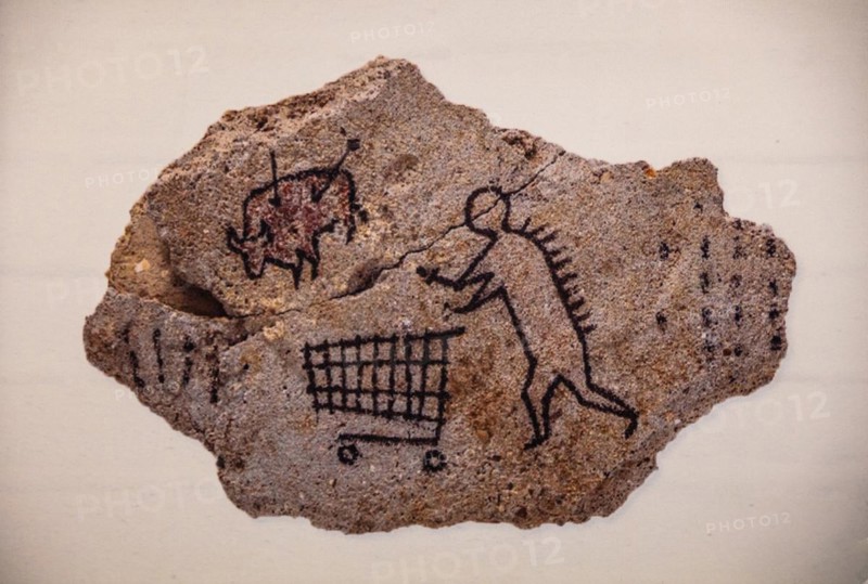 Banksys version of a primitive cave painting on the prowl with a shopping trolley