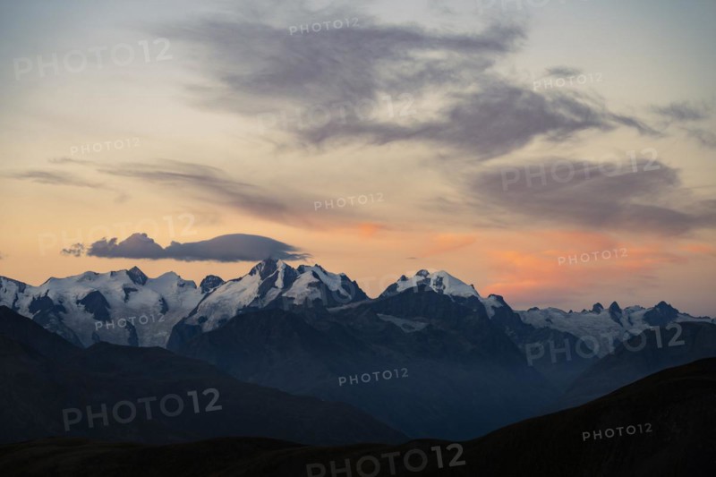 Summit of the Bernina Group with dramatic cloudy sky