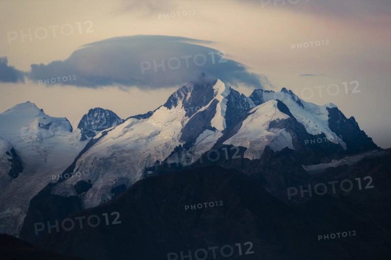 Summit of the Bernina Group with dramatic cloudy sky