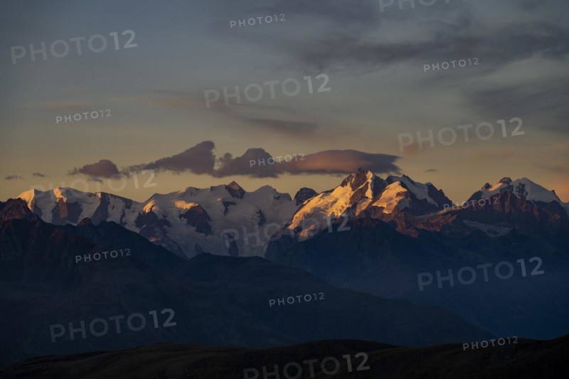 Summit of the Bernina Group with dramatic cloudy sky