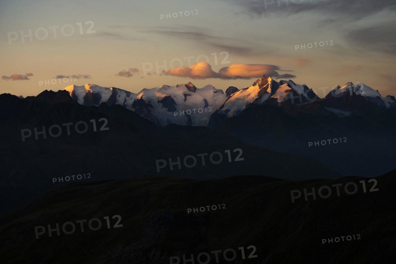 Summit of the Bernina Group with dramatic cloudy sky