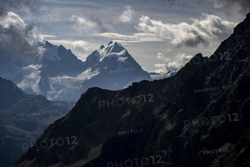 Bernina Group with Engadine Mountains with Cloudy Sky