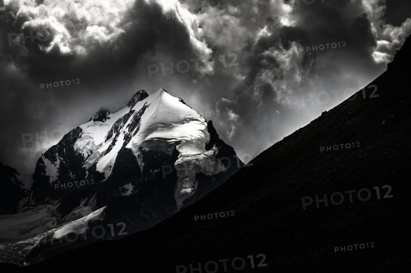 Piz Rosegg with Bernina Group and cloudy sky
