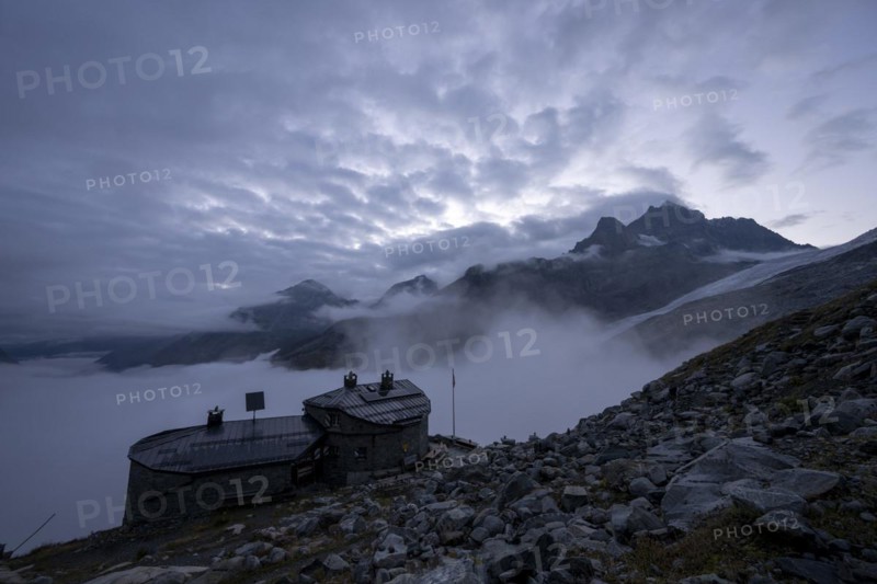 Chamanna Coaz mountain hut above the Val Rosegg valley at blue hour