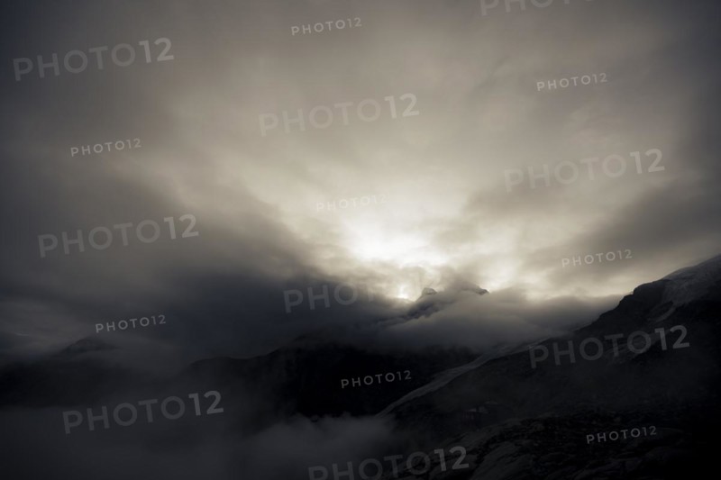 Bernina Group with Rosegg Glacier and dramatic clouds at blue hour