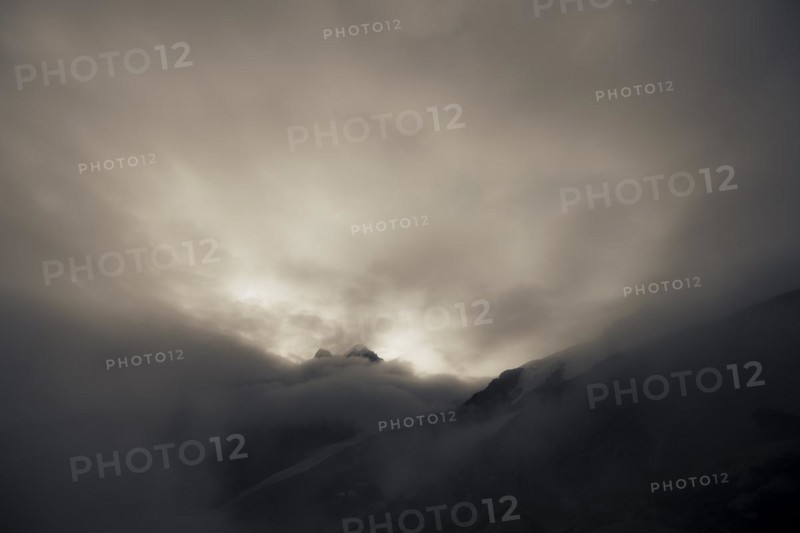 Bernina Group with Rosegg Glacier and dramatic clouds at blue hour
