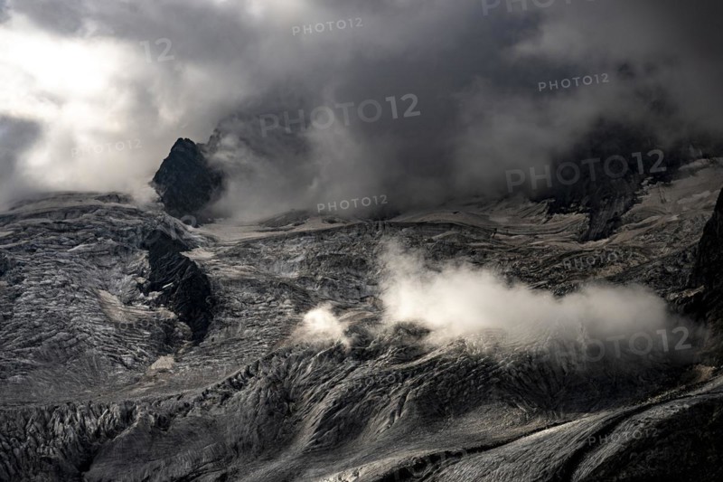 Bernina Group with Rosegg Glacier and dramatic clouds at blue hour