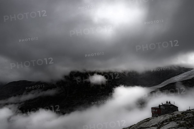 Chamanna Coaz mountain hut above the Val Rosegg valley at blue hour