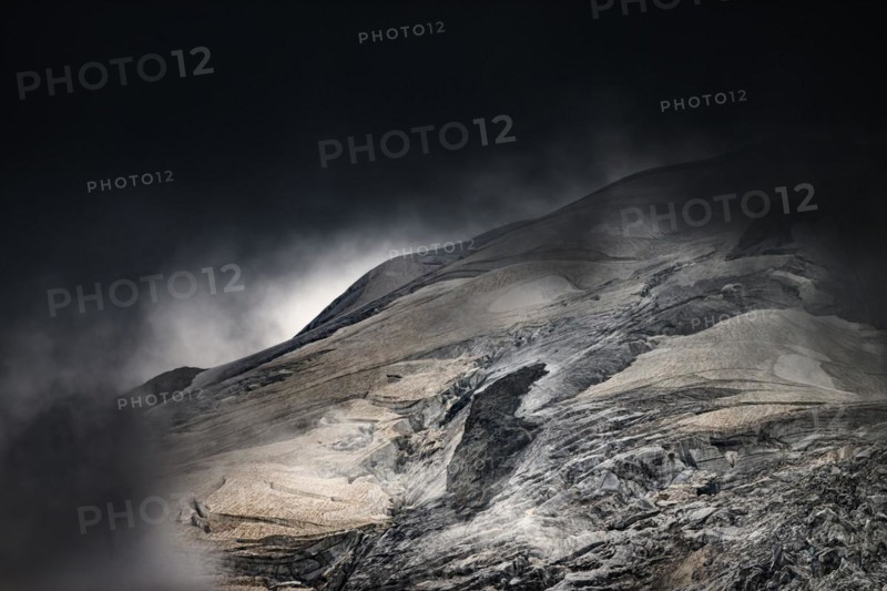 Bernina Group with Rosegg Glacier and dramatic clouds at blue hour