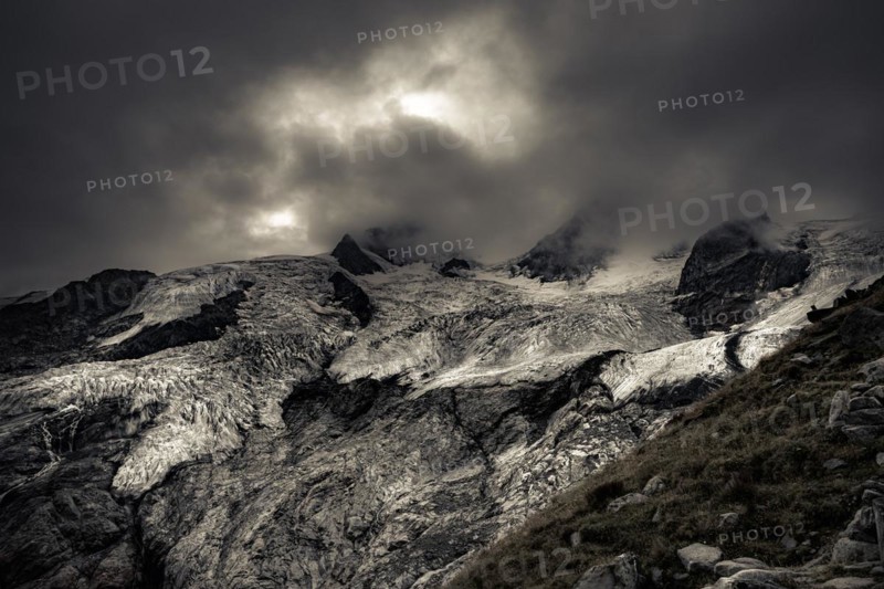 Bernina Group with Rosegg Glacier and dramatic clouds at blue hour