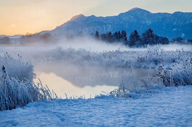 Snowy winter landscape with the Uffinger Ach at dawn with Herzogstand 1731m and Heimgarten 1790m
