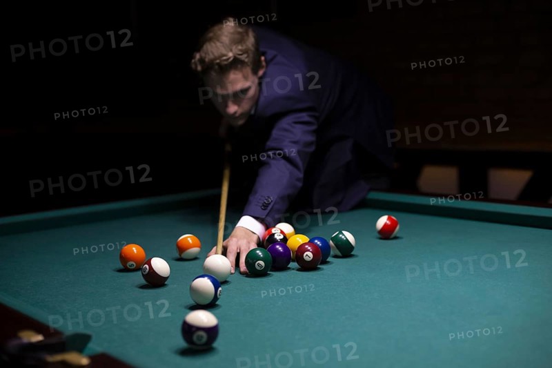 Medium shot guy suit playing game
