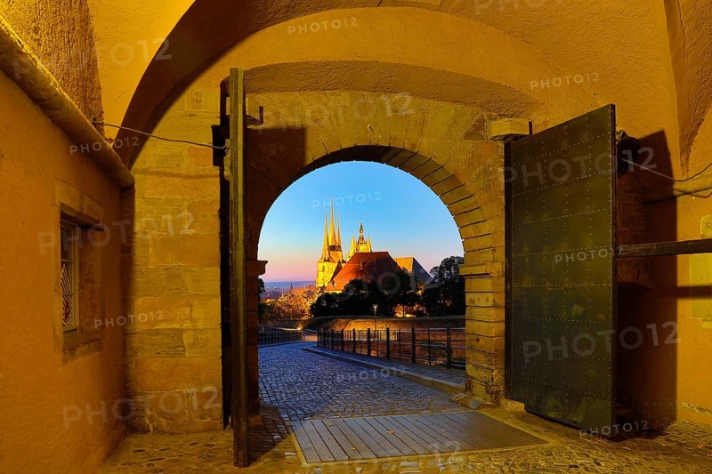 View through the Peterstor of the Petersberg Citadel of the Severi Church and Erfurt Cathedral at dawn