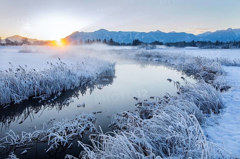Snowy winter landscape with the Uffinger Ach at sunrise with Herzogstand 1731m and Heimgarten 1790m