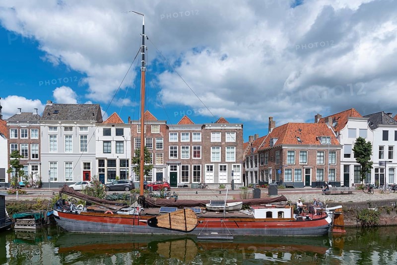 Townscape with traditional flat-bottomed sailing boat at Bierkaai