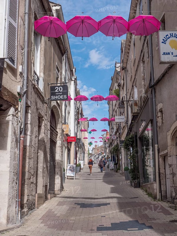 Pink umbrellas in the air