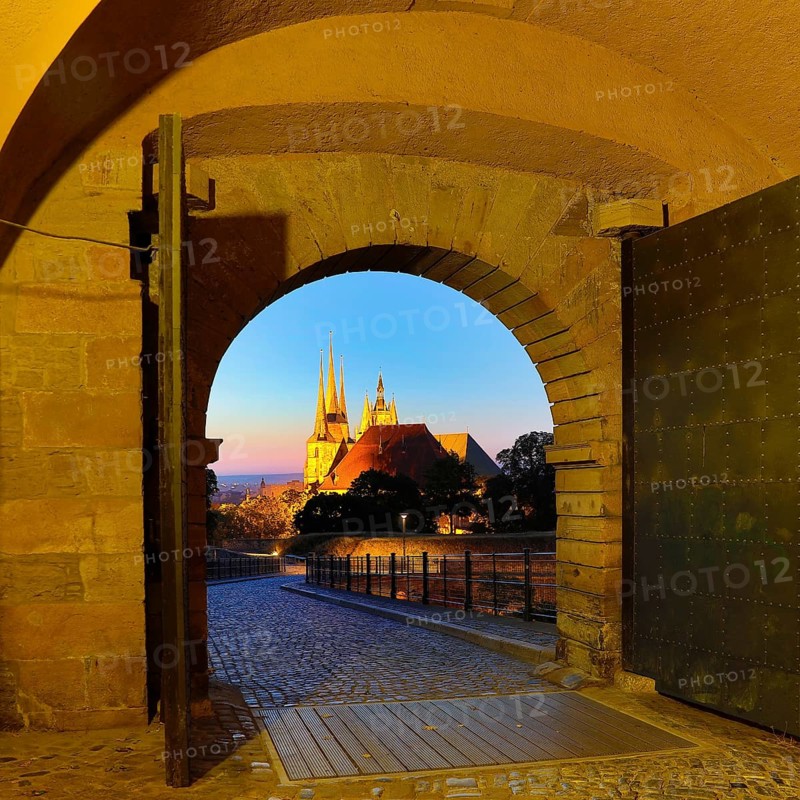 View through the Peterstor of the Petersberg Citadel of the Severi Church and Erfurt Cathedral at dawn
