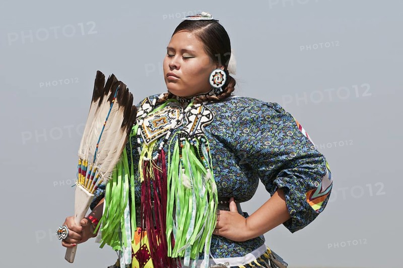 Female dancer in jingle dance regalia