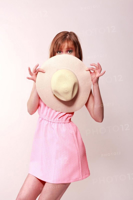 Woman with hat in hand