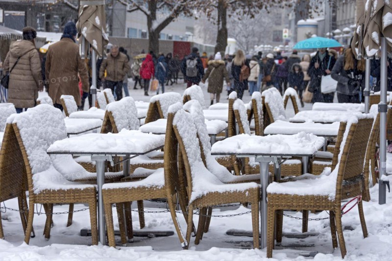 Snow-covered tables and chairs