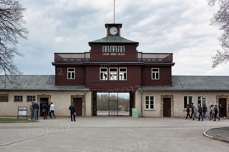 Visitors at the gate to the camp