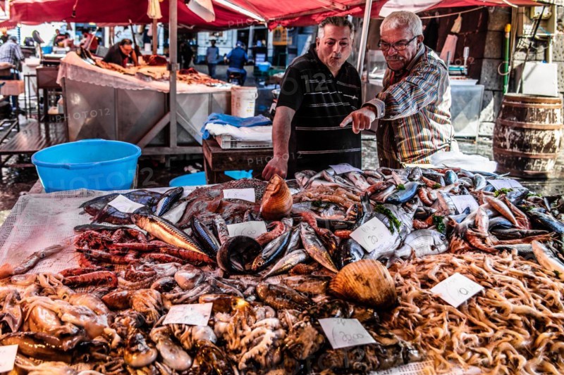 Historic fish market La pescheria with a cornucopia of colourful sea creatures