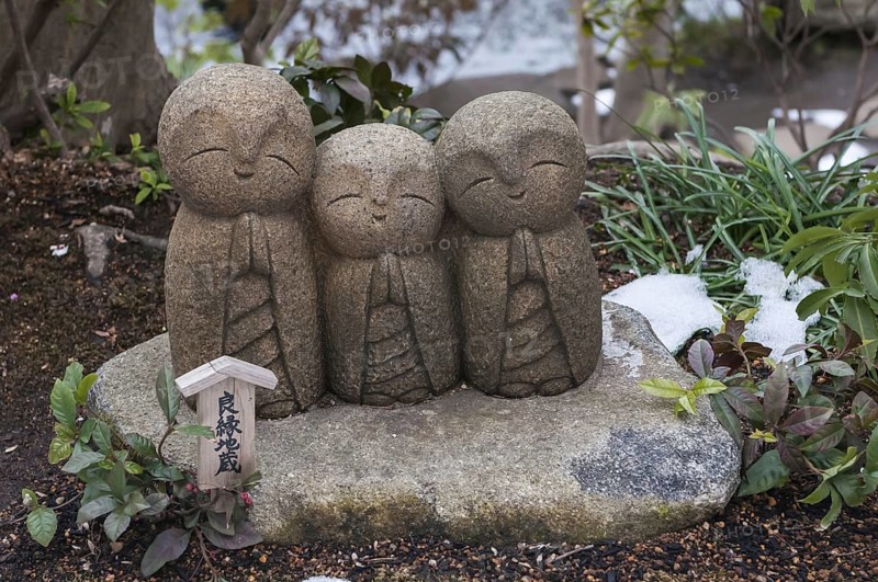 Three small stone buddhas