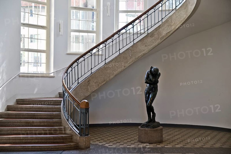 Foyer with free-swinging Art Nouveau staircase and Auguste Rodin's Eva