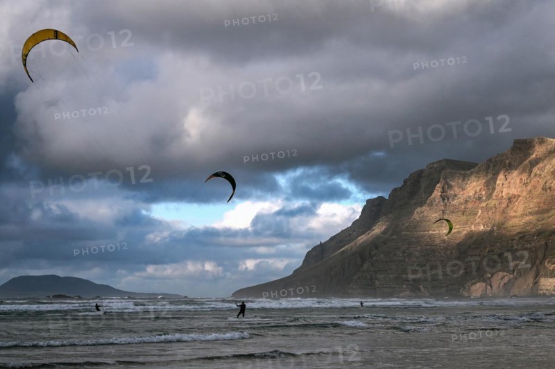 Kitesurfers on the beach of Caleta de Famara