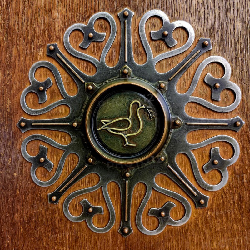 Fitting on the door to the Peace Hall with dove of peace