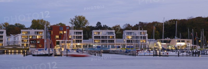 Marina and illuminated modern buildings