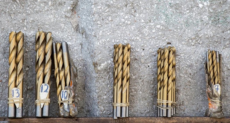 Drill bits grouped into different sizes in view