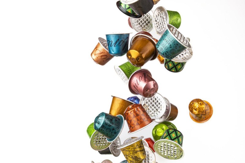 Different coloured used coffee capsules