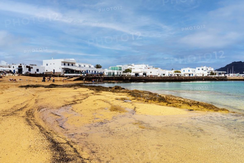 Beach and white architecture in Caleta del Sebo