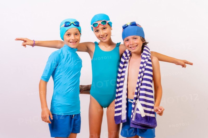 Portrait of brothers dressed in swimsuits for swimming lessons in the pool. White background