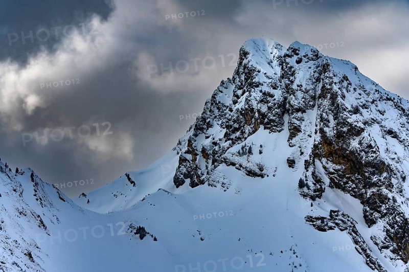 Peak of the Koellenspitze in snowy mountain landscape
