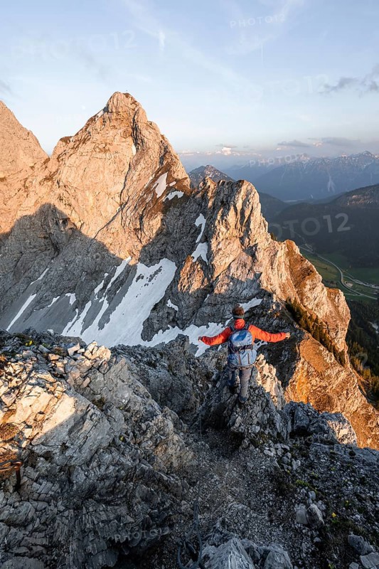 Hikers at the summit of Schartschrofen at sunset