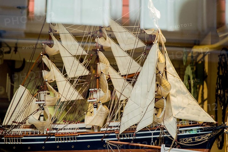 Mini size little colorful model sailboat in view
