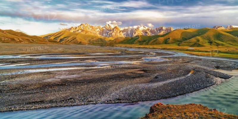 Sunset over the Central Tien Shan Mountains and glacier river
