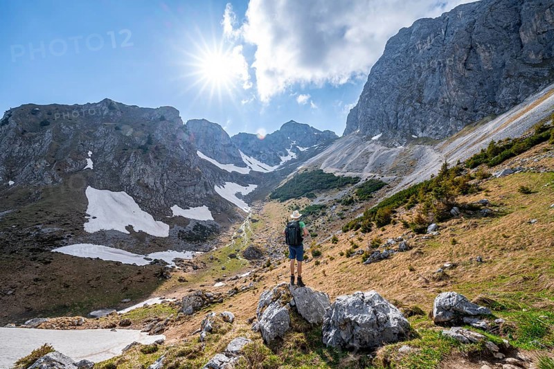 Hiker standing on a stone