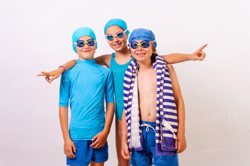 Portrait of brothers dressed in swimsuits for swimming lessons in the pool. White background
