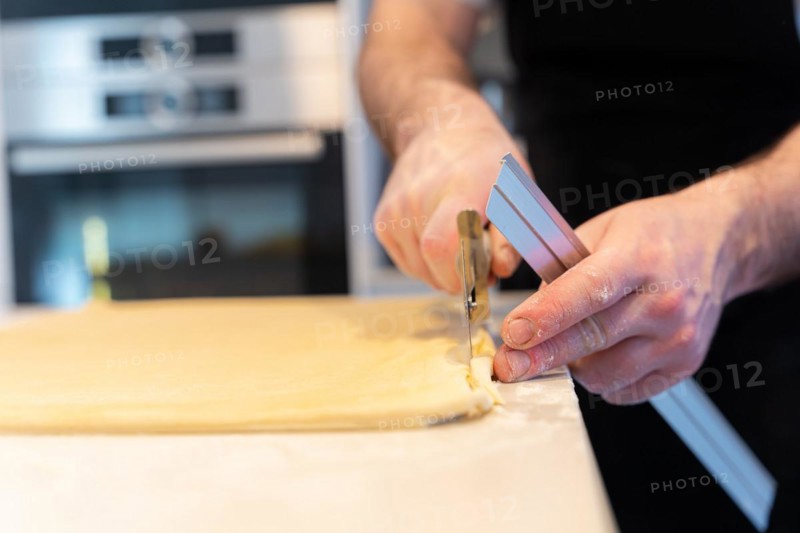 Man baking homemade croissants