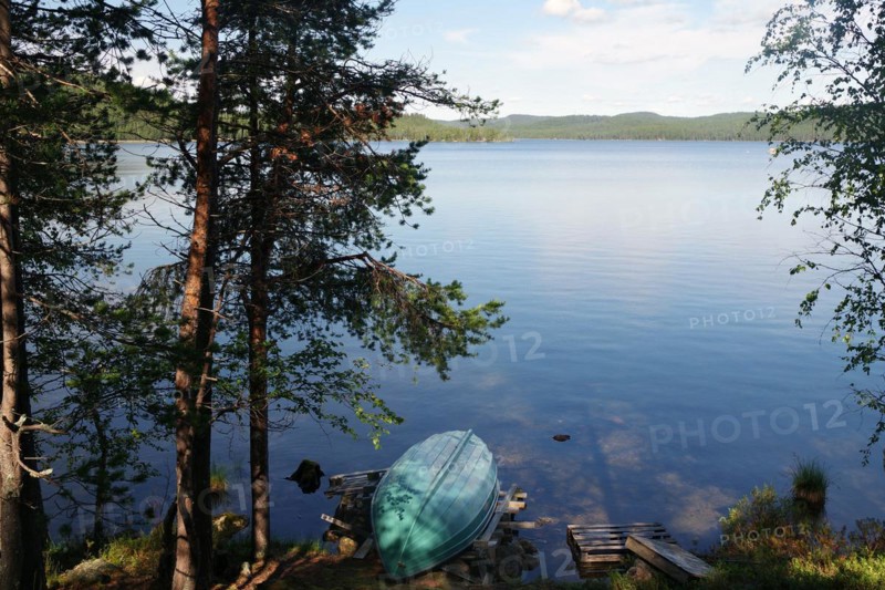 Small boat lying on a deserted lake