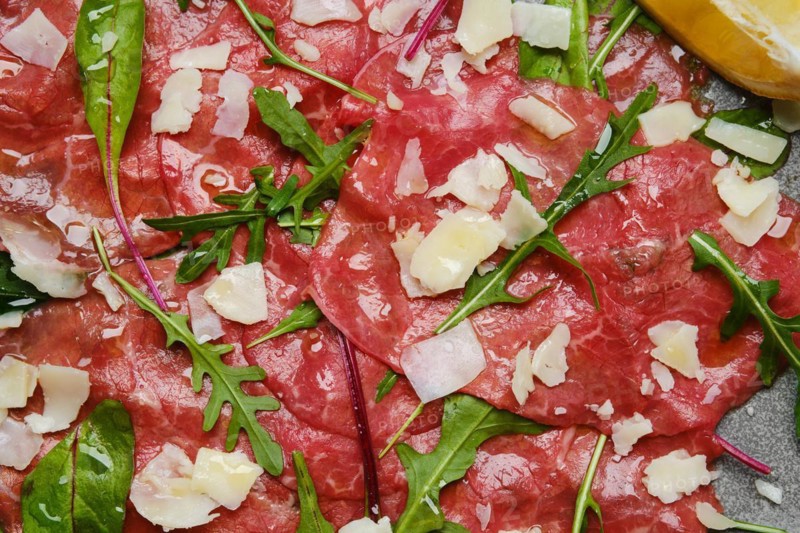 Marbled beef carpaccio with arugula and chard leaves
