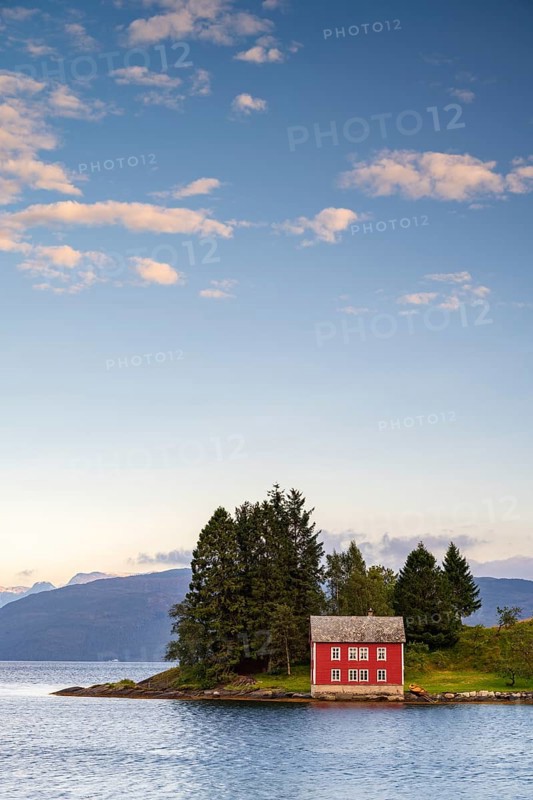 Typical red house on the island of Omaholmen in Hardangerfjord