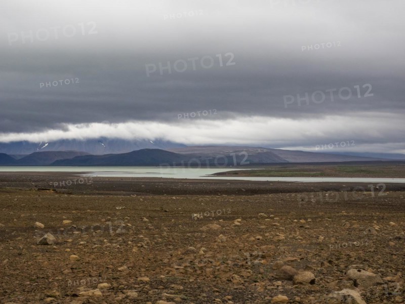 Glacial lake and barren volcanic landscape