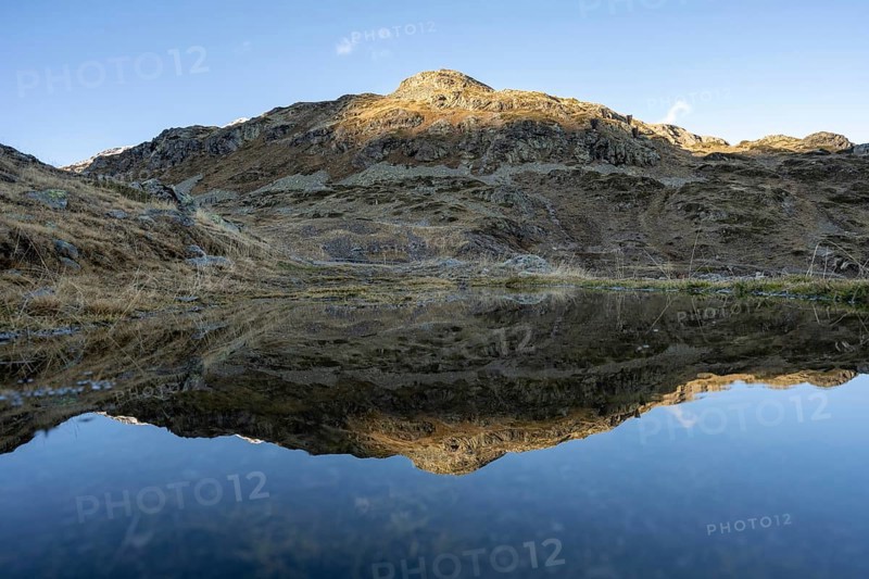 Reflection and view of the mountains at the Bernina Pass