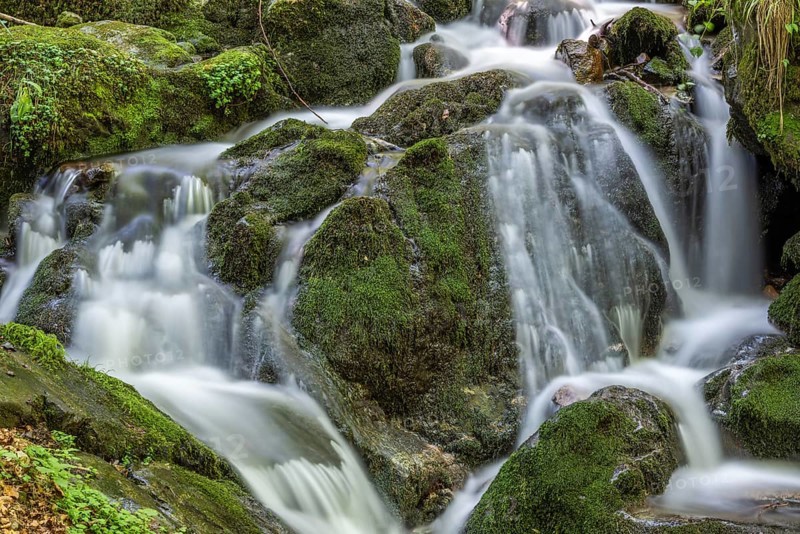 Fresh water waterfall on rocks moss cover in mountain. Fresh water waterfall on rocks moss cover in mountain.osges Alsace