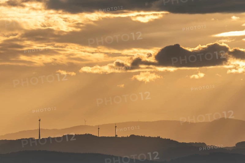 Wind turbines on the mountains of the Black Forest at dawn. Freiburg brisgau
